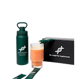 The bottle, a mixed glass, the Box for Life and a single sachet